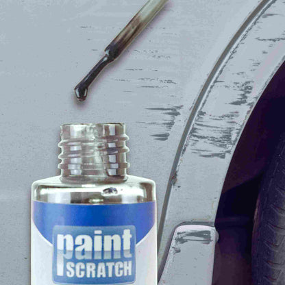 Close-up of a PaintScratch touch up bottle with brush applicator held near a scratched car fender, showing how the paint is applied to damaged areas.