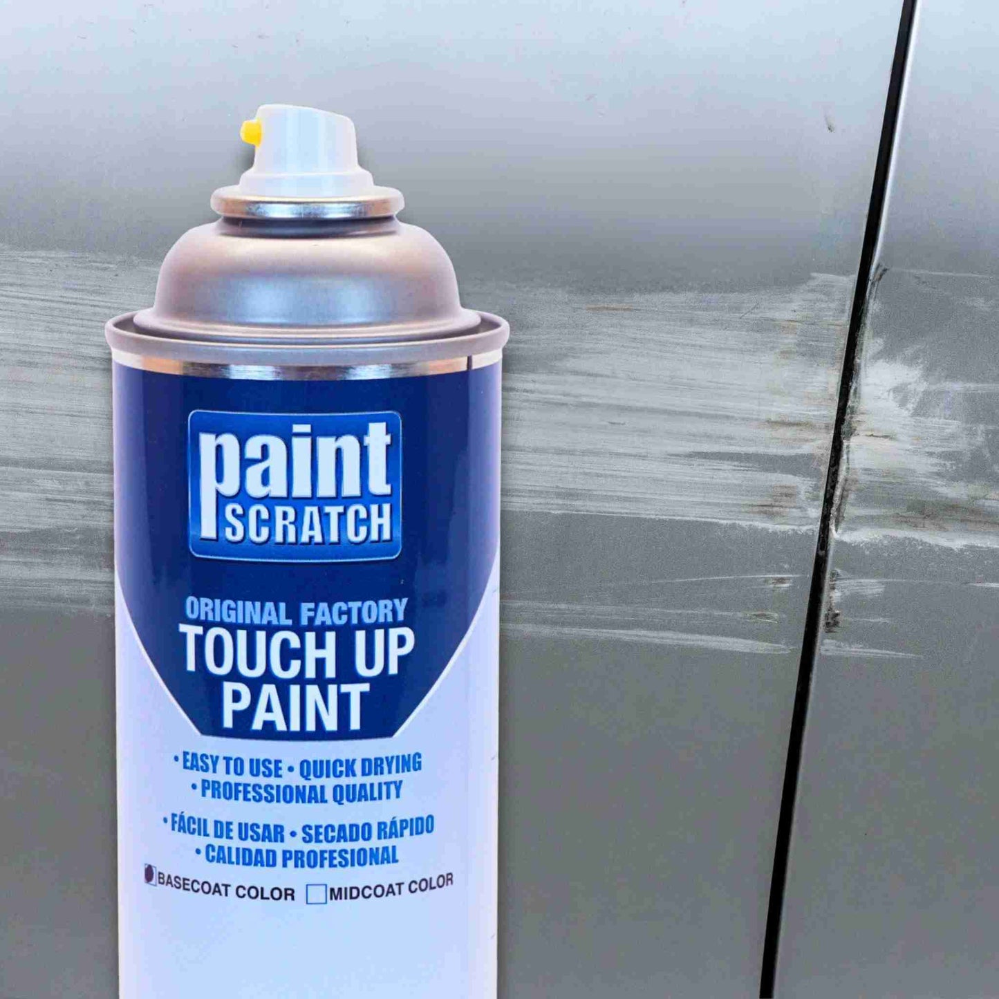 Close-up of a PaintScratch touch up spray can held in front of a scratched car door panel, showing the product used for larger repairs.